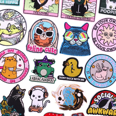 Collection of various colorful patches with different designs on a white background