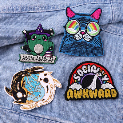 Four colorful patches on a denim background