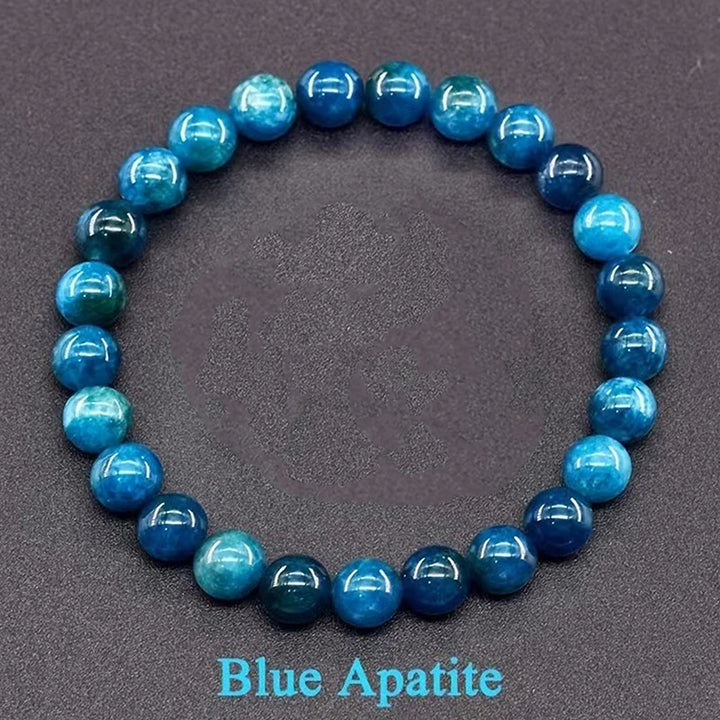 Blue apatite beaded bracelet on a dark gray background