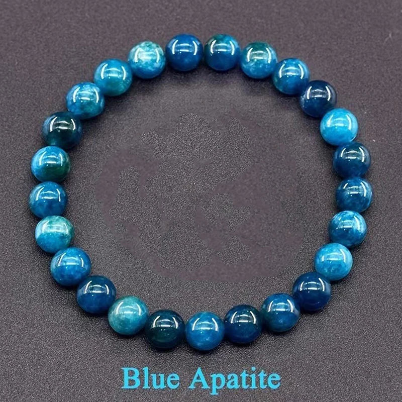 Blue apatite beaded bracelet on a dark gray background
