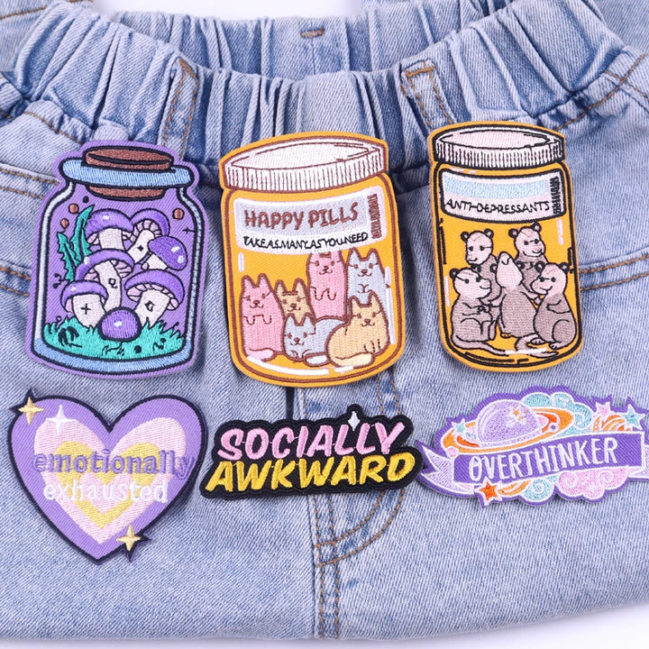 Set of colorful patches on denim fabric