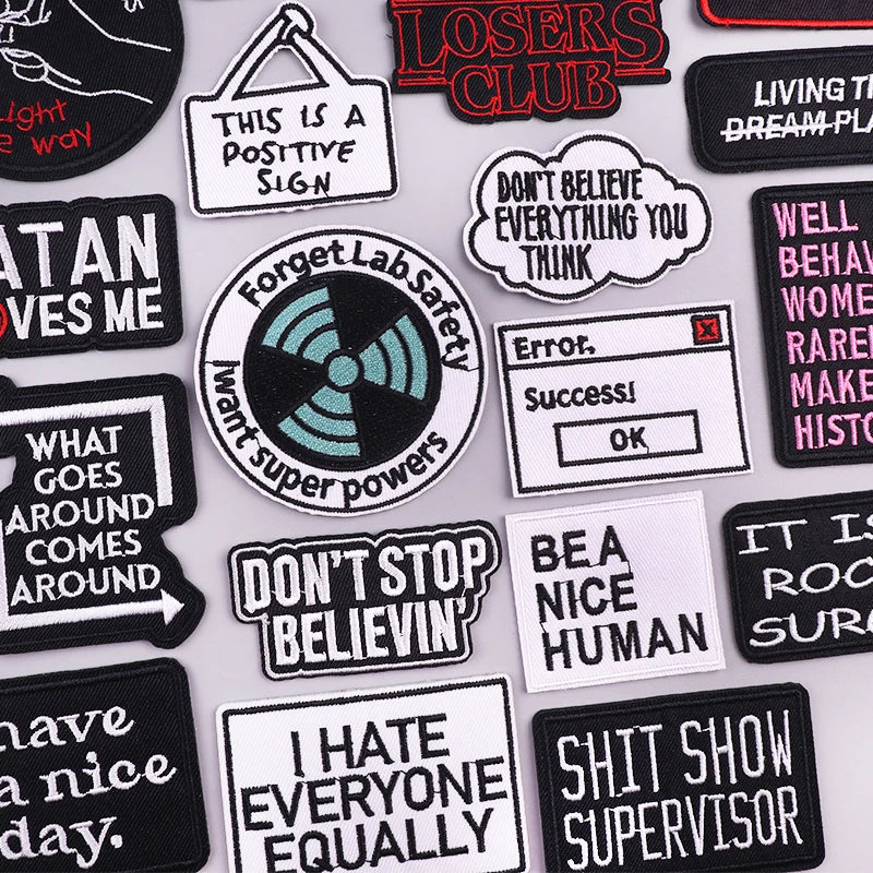 Collection of various patches with text and graphics on a white background