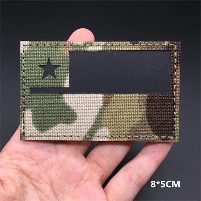 Chile flag Multicam patch held in a hand against a dark background