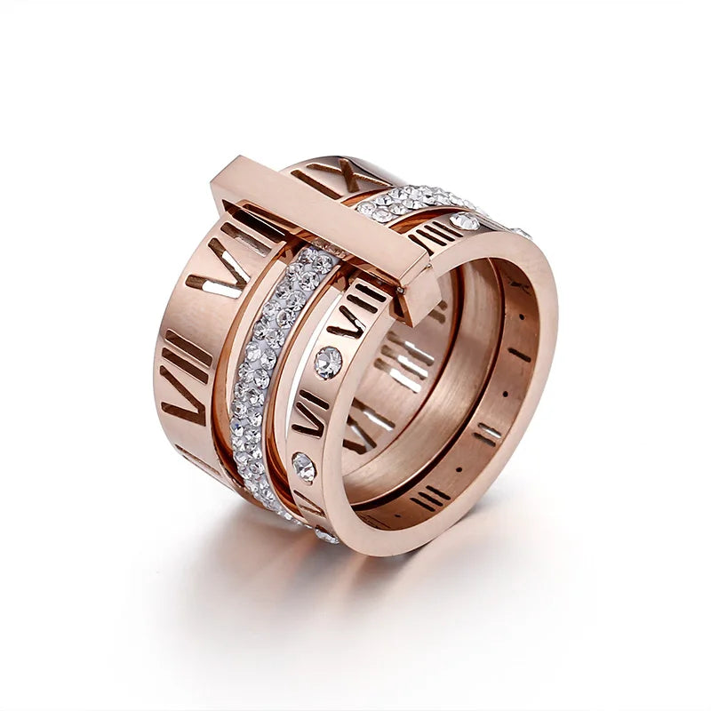Rose gold ring with diamond accents on a white background