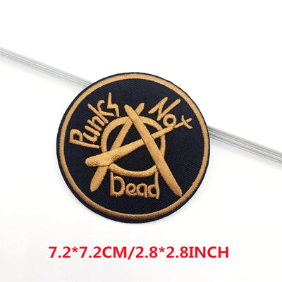 Embroidered patch with 'Punks Not Dead' text and symbol on a black background