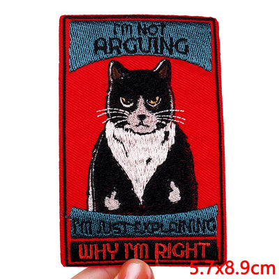 Embroidered patch with a cat illustration and text on a red background