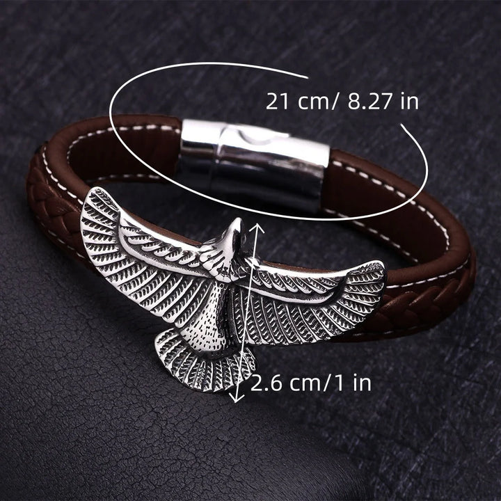 Brown leather bracelet with silver eagle design on a dark textured background with measurements