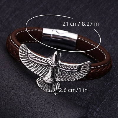 Brown leather bracelet with silver eagle design on a dark textured background with measurements