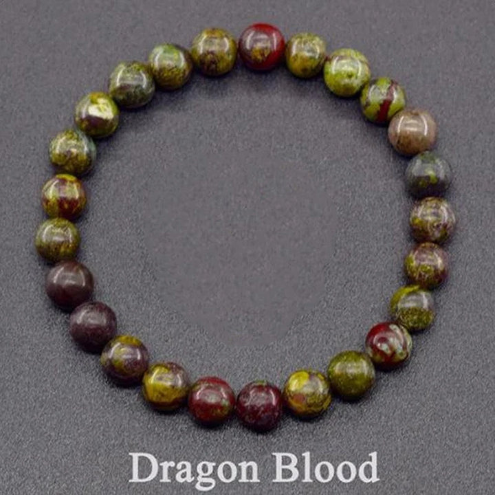 Dragon Blood stone bracelet on a dark background