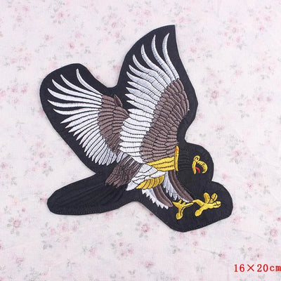 Eagle patch with outstretched wings on a floral background