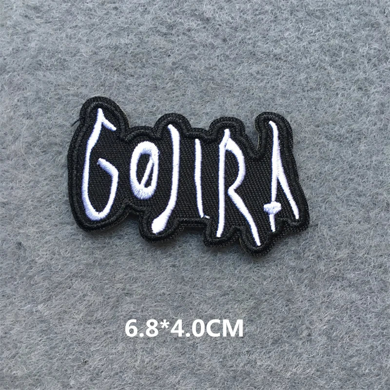 Embroidered patch with 'Gojira' text on a gray background