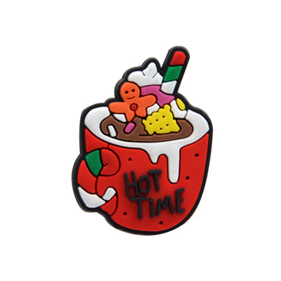 Shoe charm ornament of Colorful hot chocolate with marshmallows, gingerbread men, and candy canes on a white background