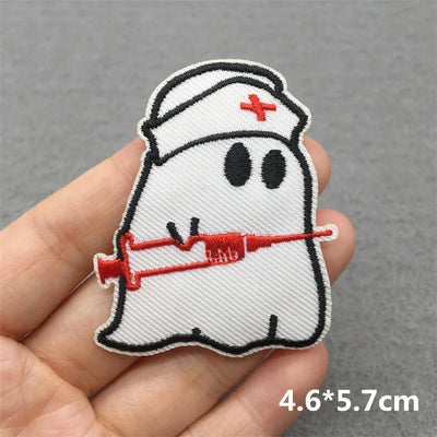 Ghost in a nurse's outfit holding a syringe patch held by a hand on a gray background