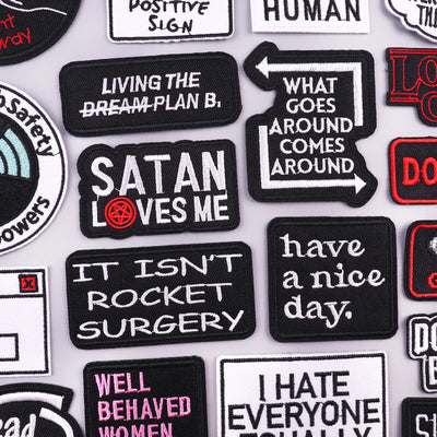 Collection of various text-based patches on a white background