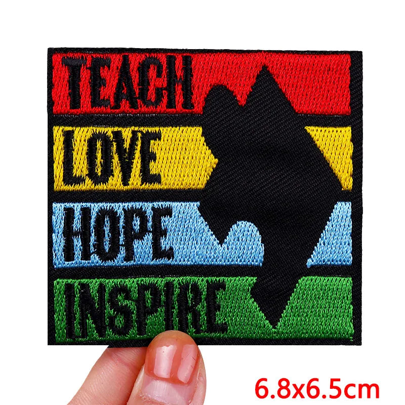 Embroidered patch with motivational text and a star silhouette held by a hand.