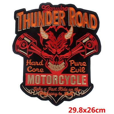 Decorative patch with 'Thunder Road' text and skull design on a black background