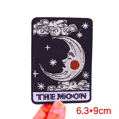Embroidered patch with moon and star design held by a hand, size 6.3*9cm.