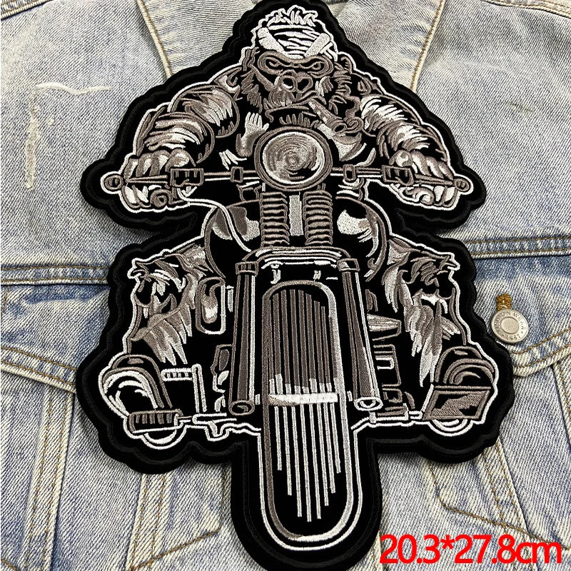 Motorcycle-themed patch on denim fabric with dimensions displayed