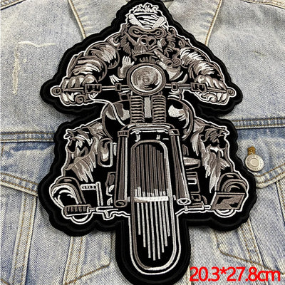 Motorcycle-themed patch on denim fabric with dimensions displayed