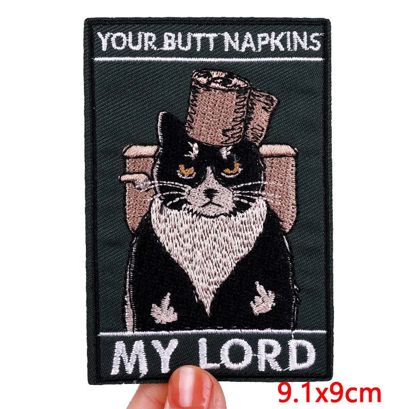 Embroidered patch with a cat in a top hat and monocle, labeled &