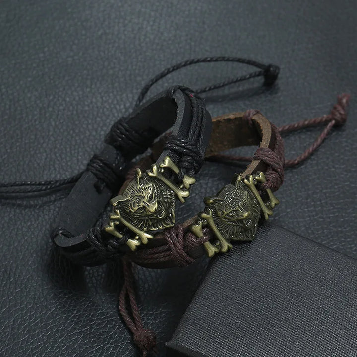 Bracelets with wolf head designs on a textured surface
