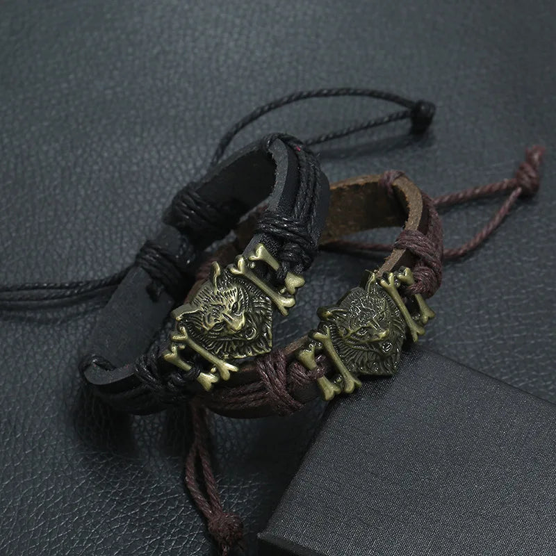 Bracelets with wolf head designs on a textured surface