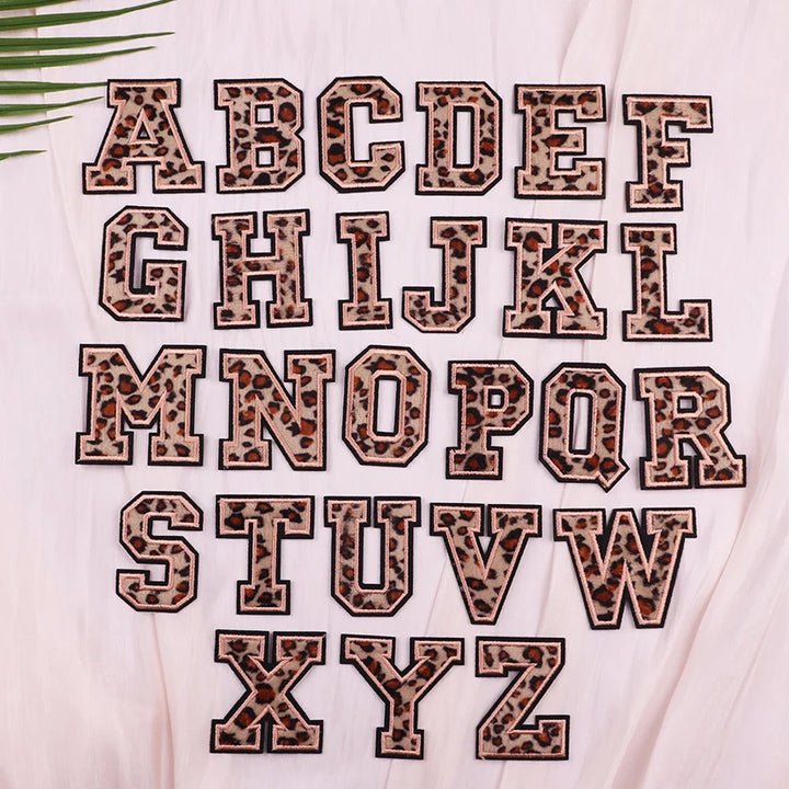Leopard print alphabet letters on a light background
