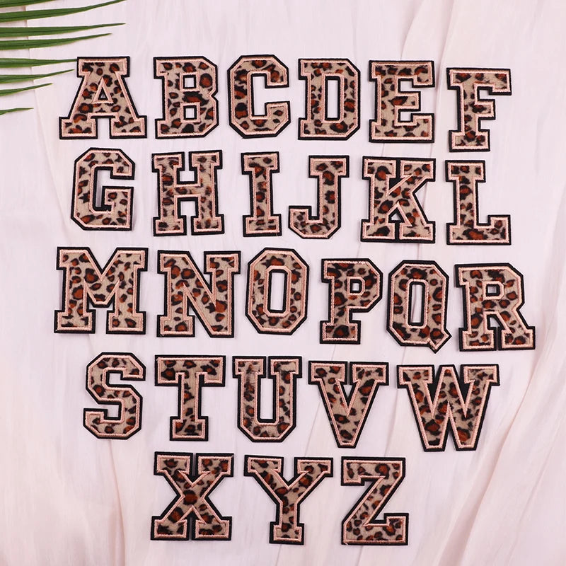 Leopard print alphabet letters on a light background