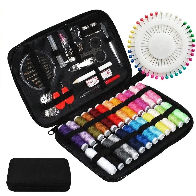 Sewing kit with threads, pins, and tools in a black case on a white background