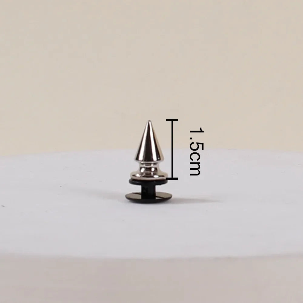 Metallic cone-shaped object with measurement label on a beige background