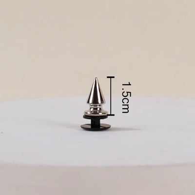 Metallic cone-shaped object with measurement label on a beige background
