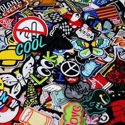 Collection of various colorful patches with different designs and text.