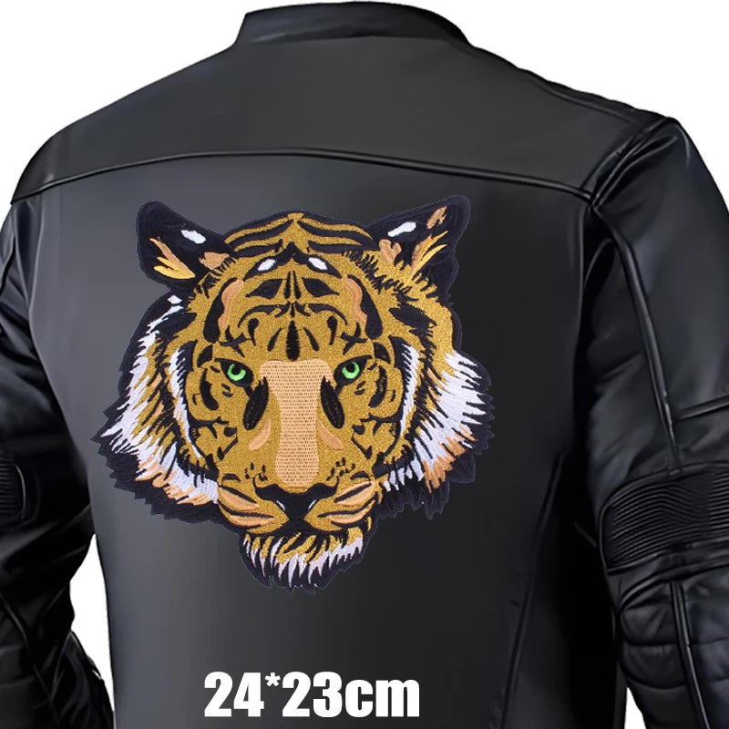 Black jacket with a large embroidered tiger design on the back, size 24x23cm.