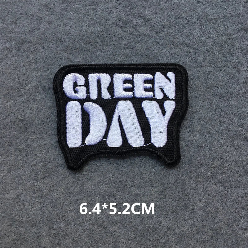 Embroidered patch with 'Green Day' text on a gray background