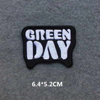 Embroidered patch with 'Green Day' text on a gray background