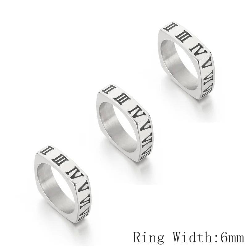 Three silver rings with Roman numeral design on a white background