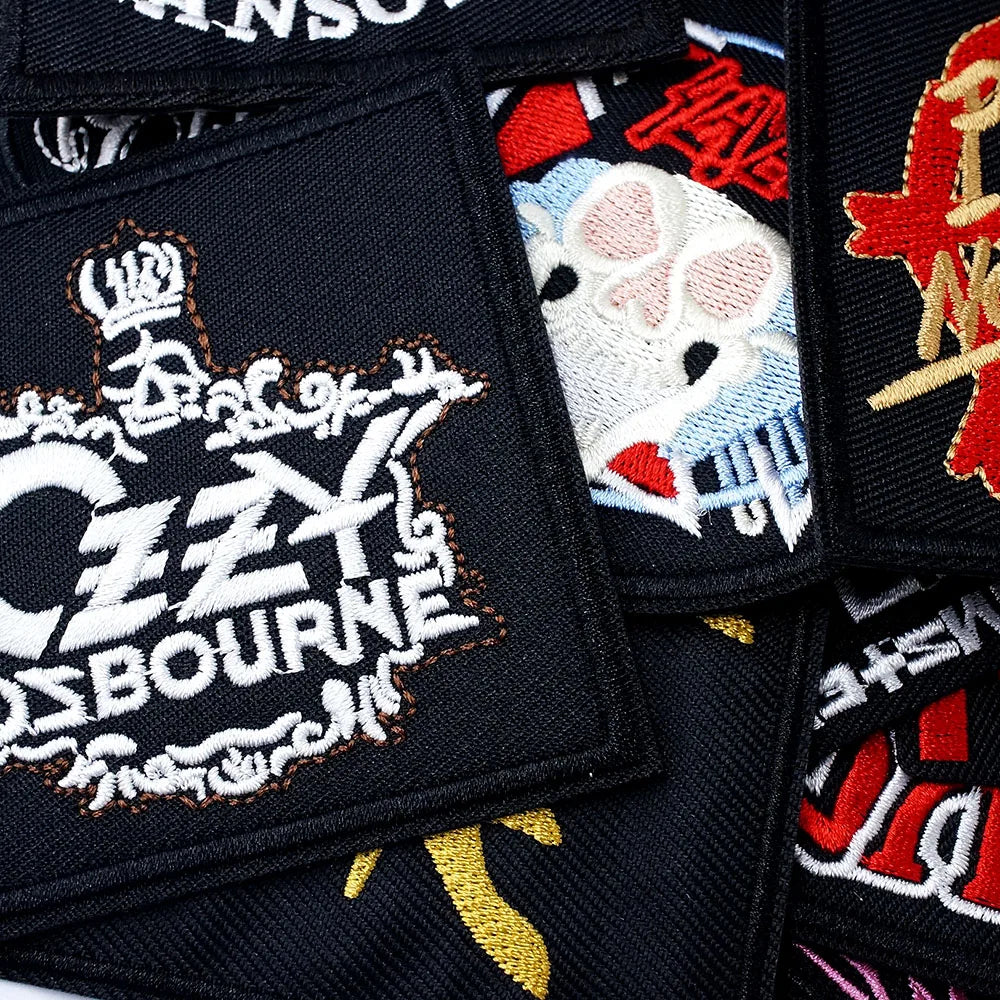Collection of embroidered patches with various designs, including a prominent 'Ozzy Osbourne' patch.