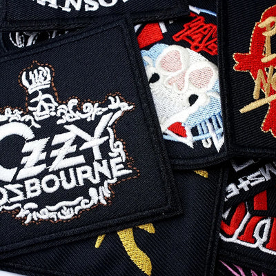Collection of embroidered patches with various designs, including a prominent 'Ozzy Osbourne' patch.