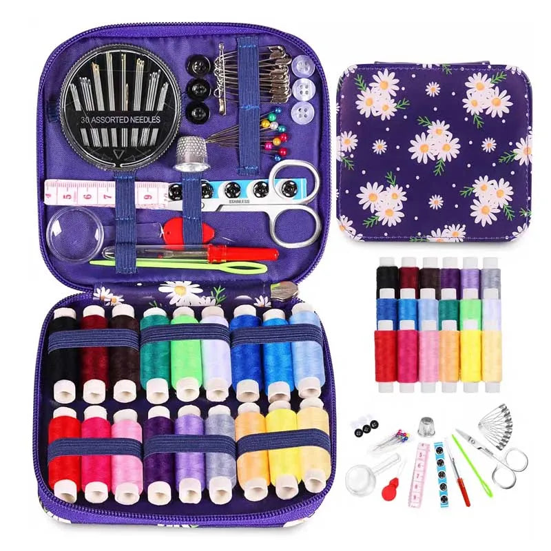 Open purple Sewing kit with colorful threads, needles, and tools in a purple case with floral design.