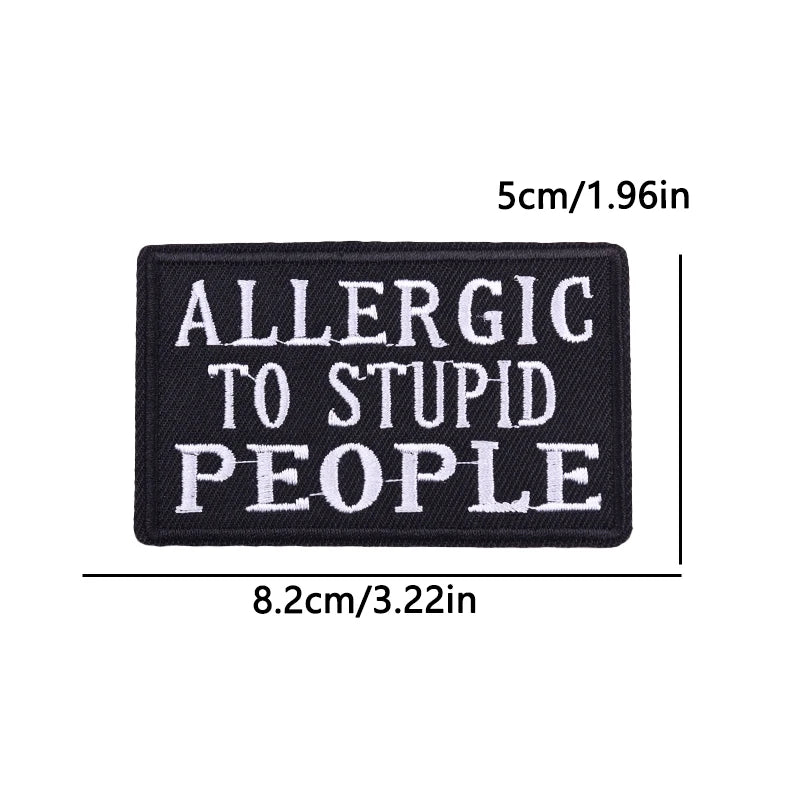 Black patch with white text 'ALLERGIC TO STUPID PEOPLE' and measurements on a white background