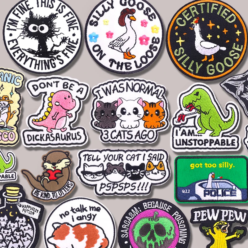 Collection of various stickers with different designs and text on a gray background