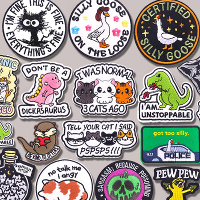Collection of various stickers with different designs and text on a gray background