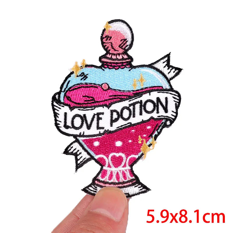 Patch of a love potion with text held by a finger on a white background