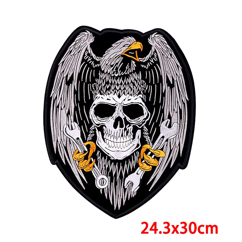 Skull with wings and tools design on a black background, size 24.3x30cm.