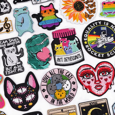 Collection of colorful patches with various designs on a white background