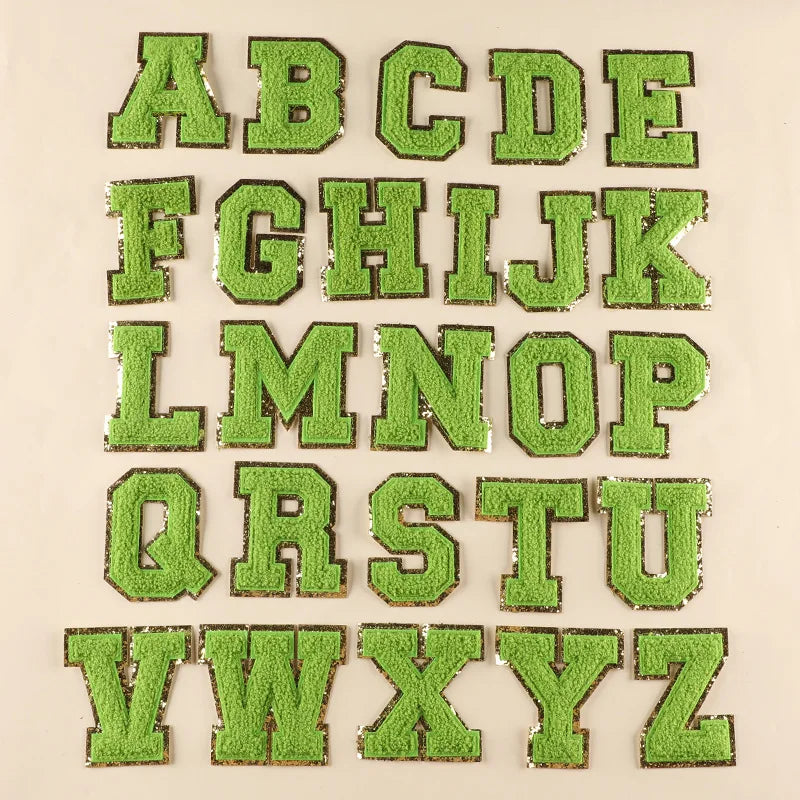 Green letters of the alphabet on a beige background
