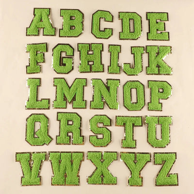 Green letters of the alphabet on a beige background