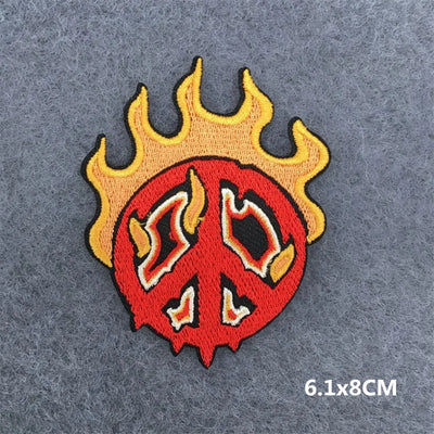 Peace symbol with flames on a gray background