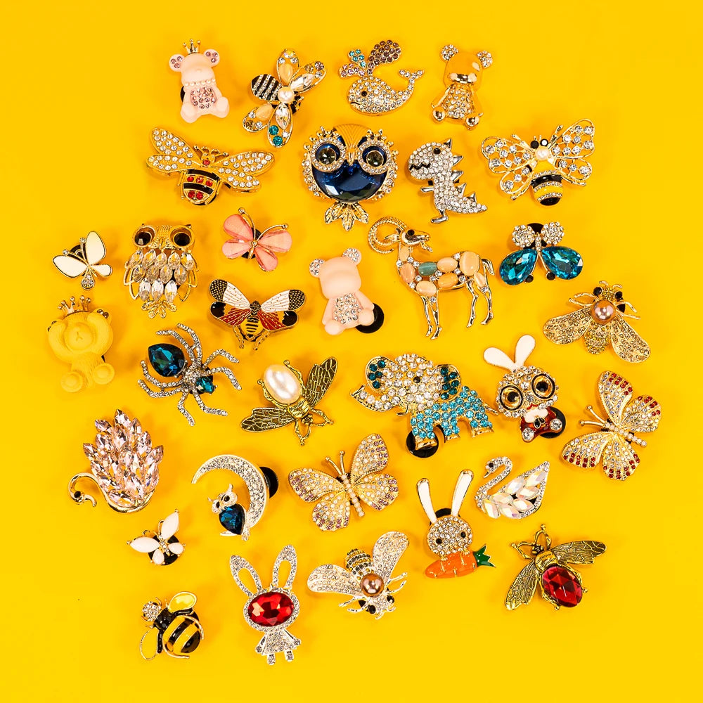 Collection of various shoe charms on a yellow background