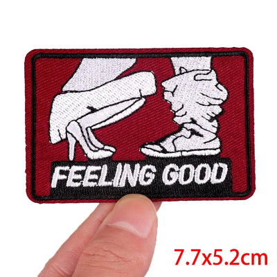 Patch with 'Feeling Good' text held by a hand, on a white background